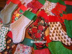 100+ Christmas stockings were made for the residents of Self Nursing Home. Dolls & little dresses for Operation Christmas Child boxes.